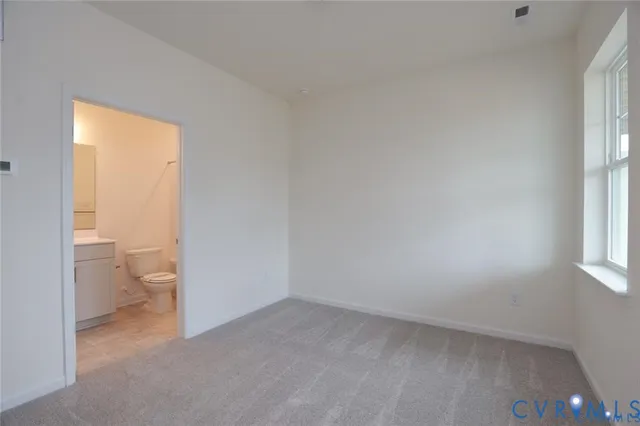 a view of a bathroom with a toilet