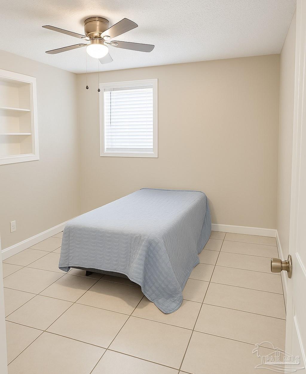 6274 Munson Highway Milton, FL 32570 - Photo 20 of 26 a bedroom with a bed and a window