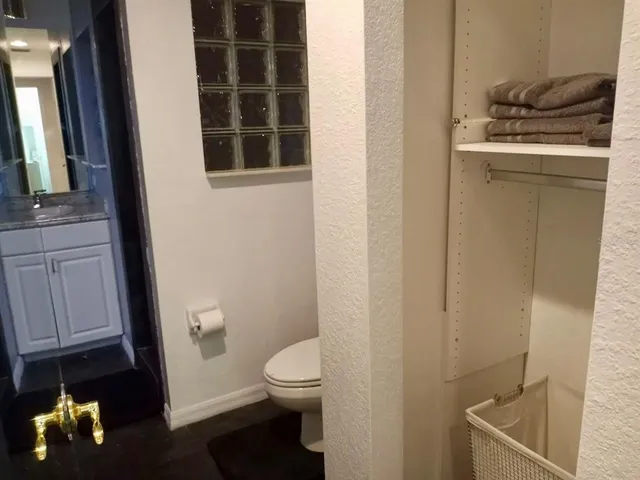 a bathroom with a toilet sink and tub