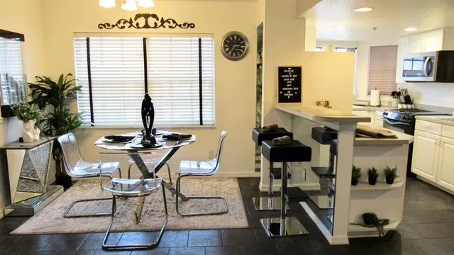 a view of a dining room with furniture and wooden floor
