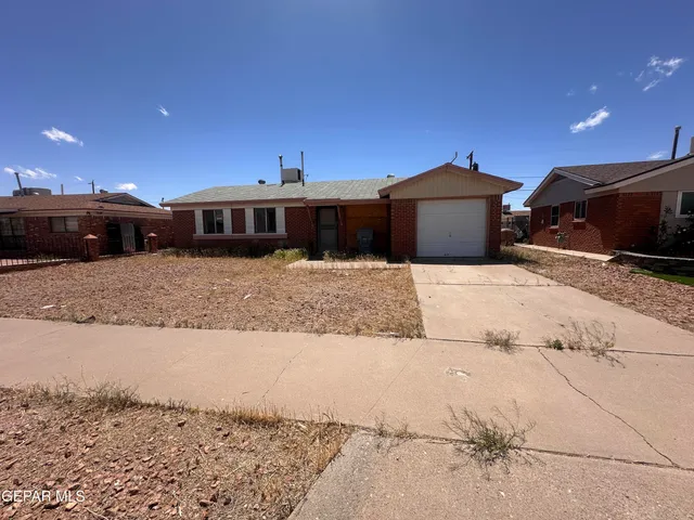 a view of a car parked in front of house