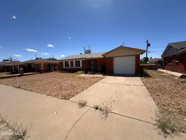 a view of a house with a snow in the yard