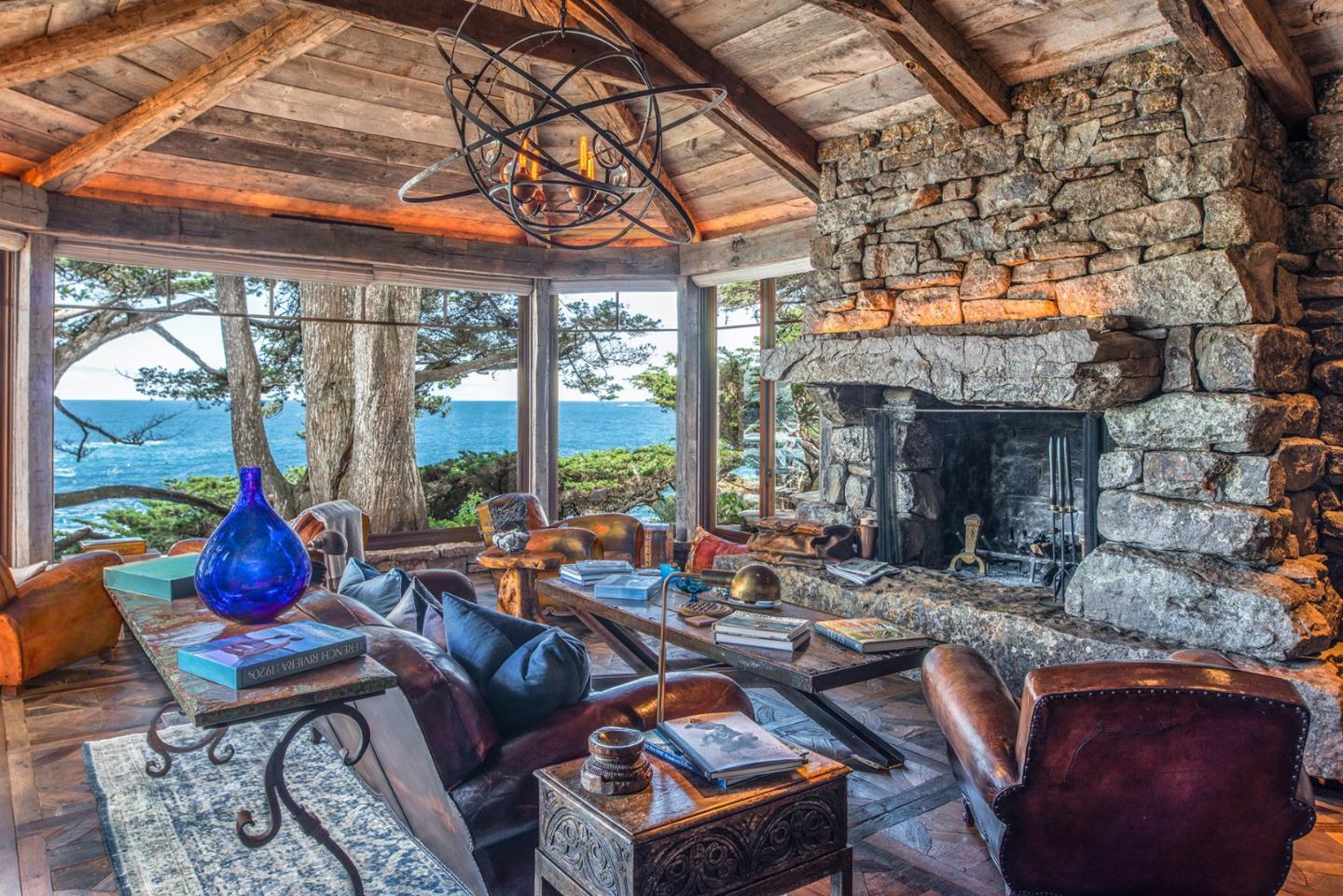 157-163 Spindrift Road Carmel, CA 93923 - Photo 9 of 100 a living room with patio furniture and a fireplace