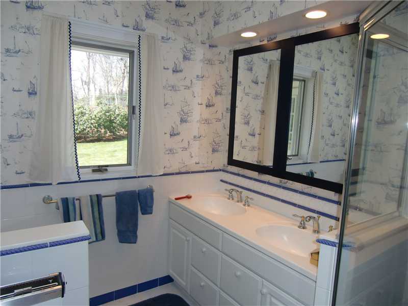 103 Summit Road Riverside, CT 06878 - Photo 11 of 17 a bathroom with a tub sink and mirror