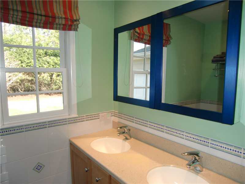 103 Summit Road Riverside, CT 06878 - Photo 14 of 17 a bathroom with a sink and a mirror