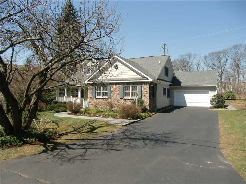 103 Summit Road Riverside, CT 06878 - Photo 3 of 17 a front view of a house with a yard