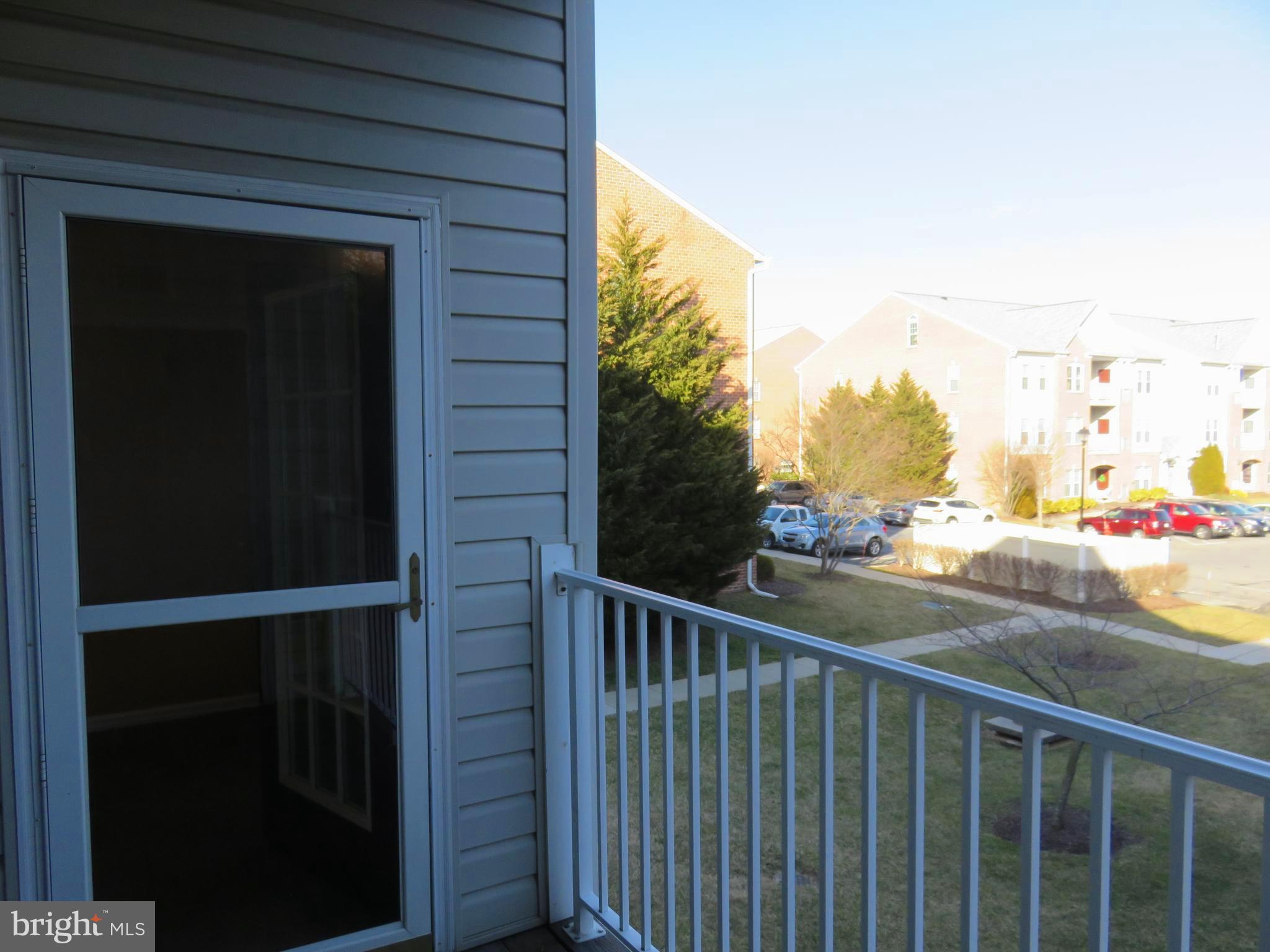 NEWER STORM DOOR FROM DEN TO BALCONY