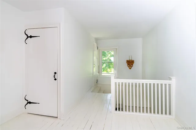 a living room with furniture and a painting