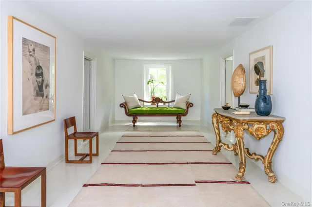 a bedroom with a bed and a lamp