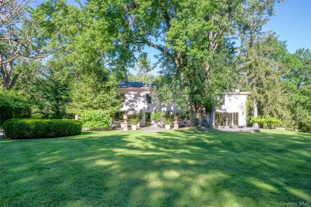a view of a chairs and table on the garden