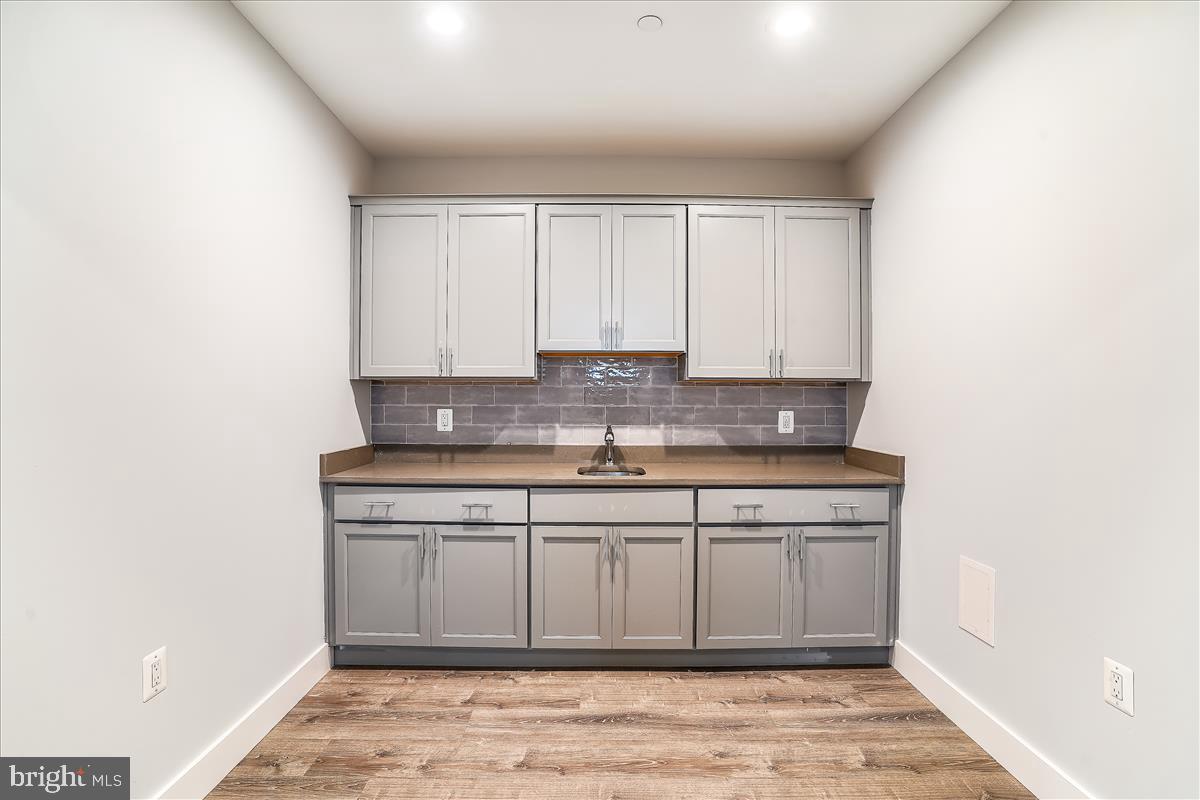 2722 Jennings Road Kensington, MD 20895 - Photo 46 of 58 Wet bar off Rec room in basement