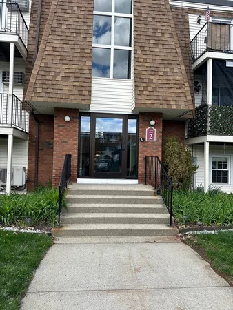 a front view of a house with a porch