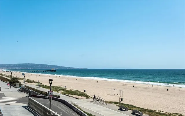 a bedroom with a bed and glass windows