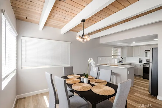 a large bedroom with bed and a table