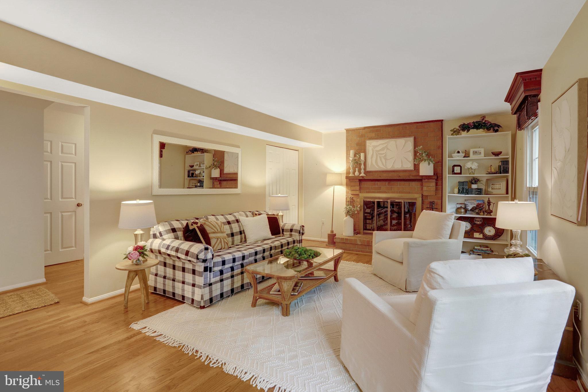 7006 Maple Tree Lane Springfield, VA 22152 - Photo 15 of 49 a living room with furniture fireplace and a window