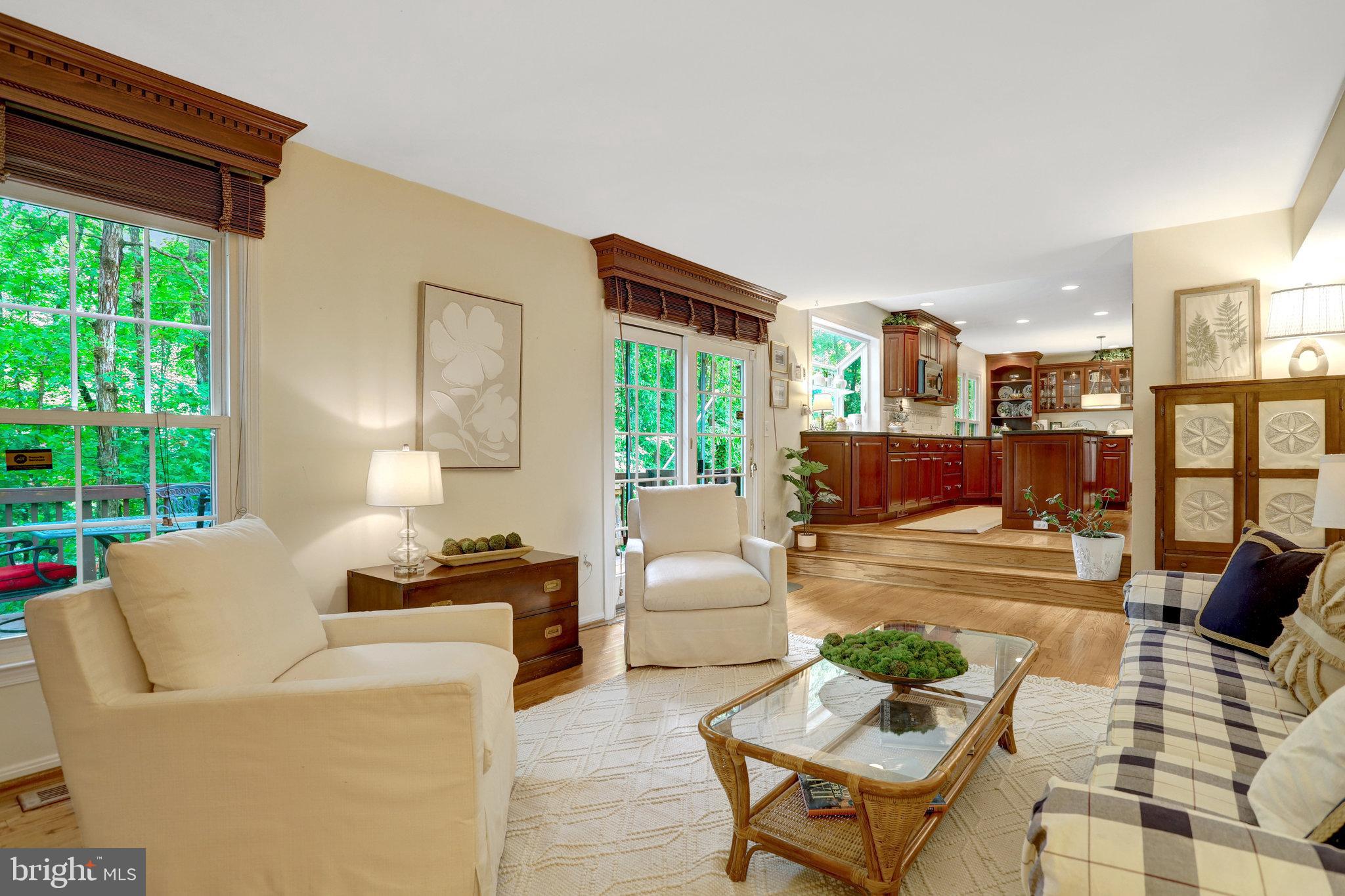 7006 Maple Tree Lane Springfield, VA 22152 - Photo 17 of 49 a living room with furniture and a large window