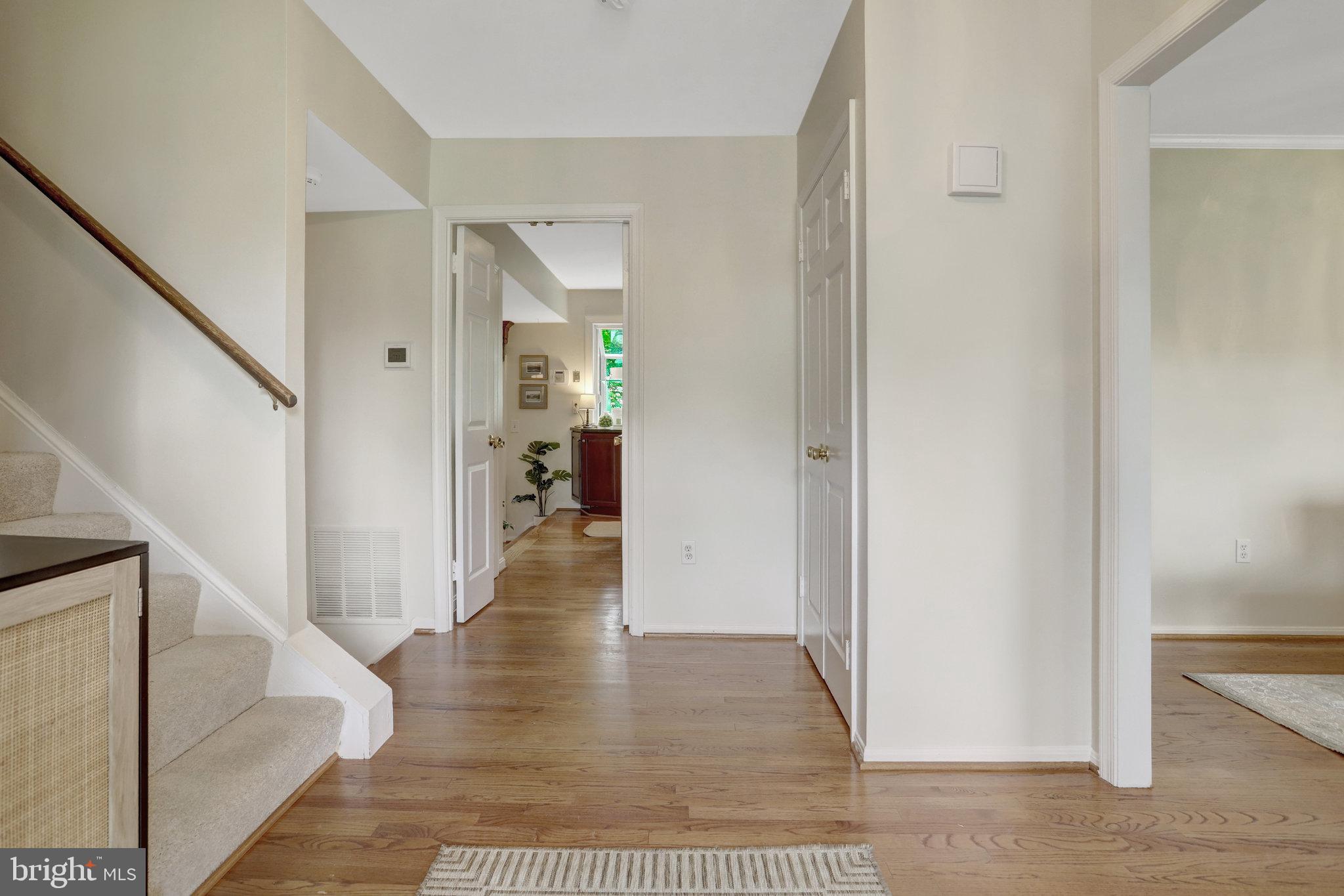 7006 Maple Tree Lane Springfield, VA 22152 - Photo 20 of 49 a view of a hallway with wooden floor and staircase