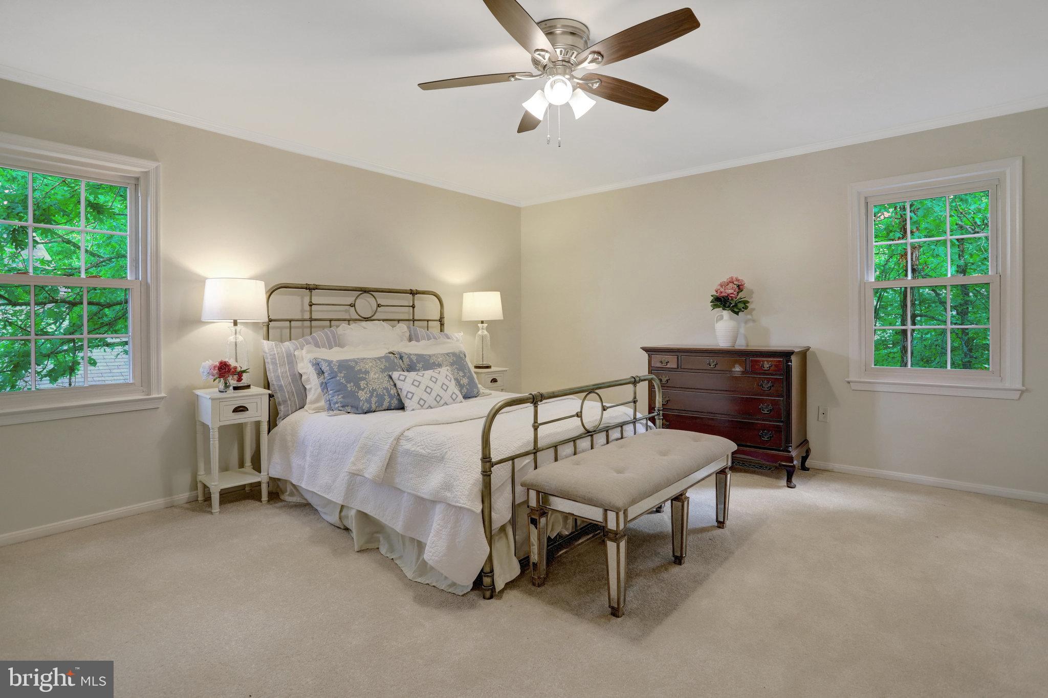 7006 Maple Tree Lane Springfield, VA 22152 - Photo 22 of 49 a bed room with a bed and a window