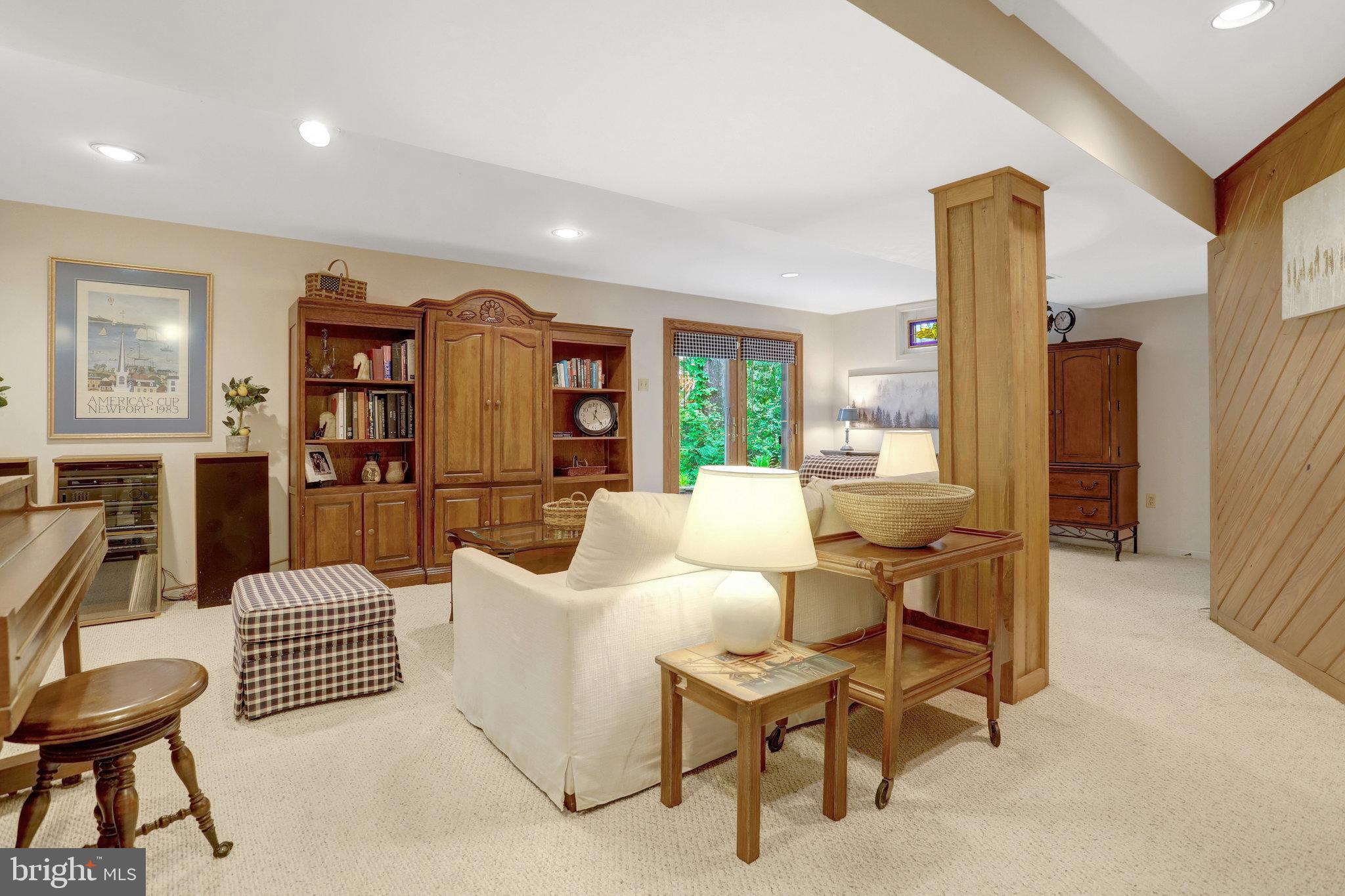 7006 Maple Tree Lane Springfield, VA 22152 - Photo 34 of 49 a living room with furniture and a large window