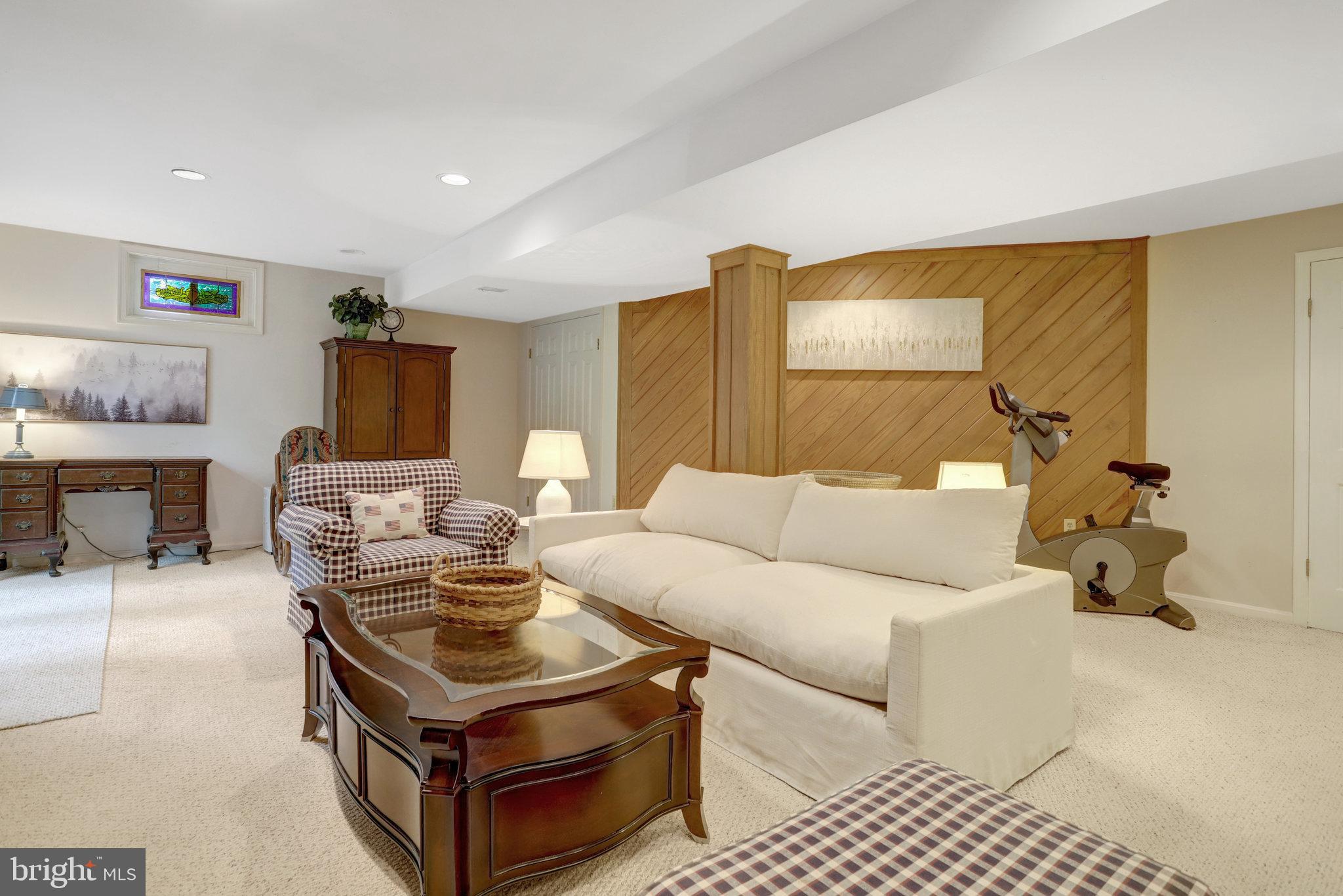 7006 Maple Tree Lane Springfield, VA 22152 - Photo 36 of 49 a living room with furniture and a fireplace
