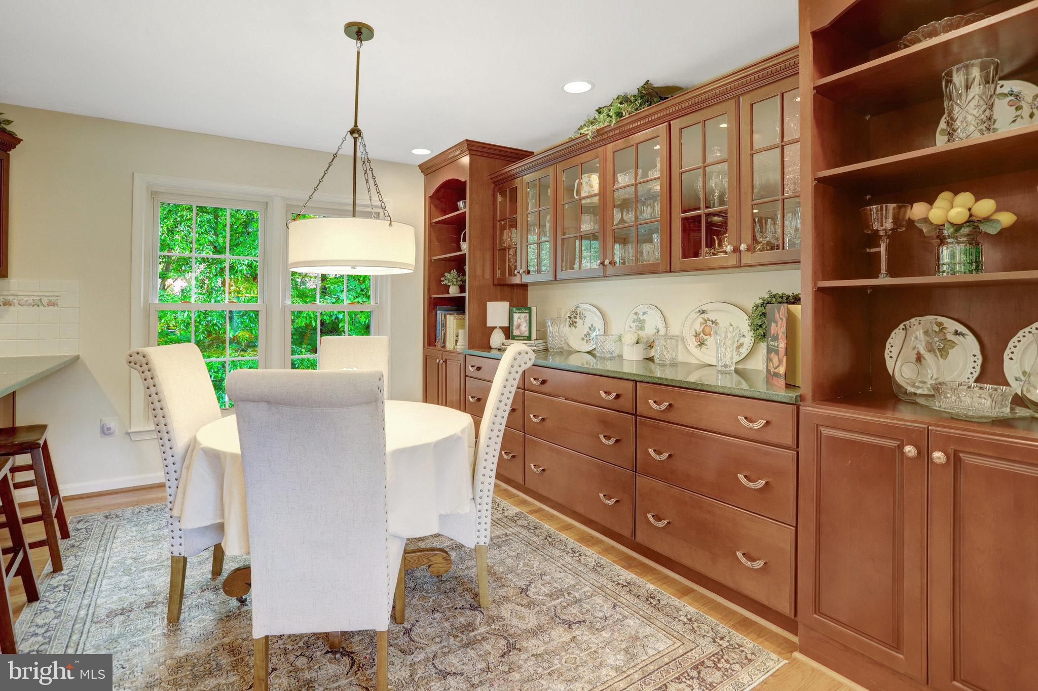 7006 Maple Tree Lane Springfield, VA 22152 - Photo 7 of 49 a view of a dining area with furniture window and wooden floor
