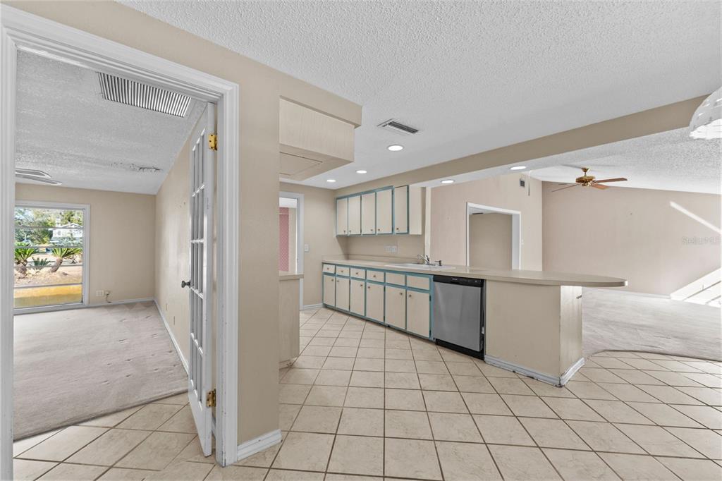 27814 Quail View Lane Wesley Chapel, FL 33544 - Photo 13 of 26 a large white kitchen with a sink and cabinets