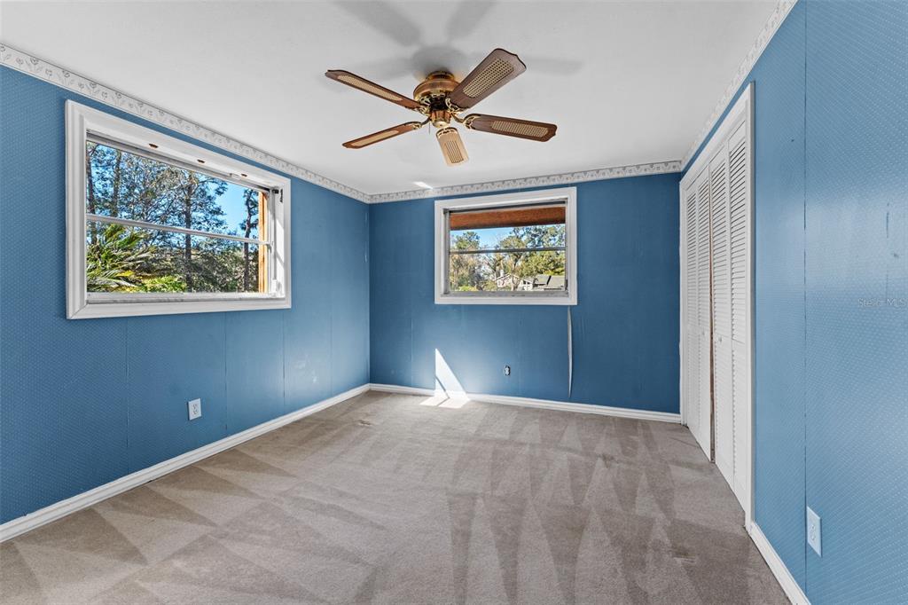 27814 Quail View Lane Wesley Chapel, FL 33544 - Photo 20 of 26 a view of room with window and ceiling fan