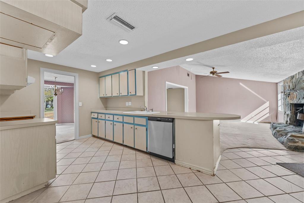 27814 Quail View Lane Wesley Chapel, FL 33544 - Photo 8 of 26 a kitchen with granite countertop a refrigerator and a sink