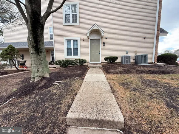 a front view of a house with yard