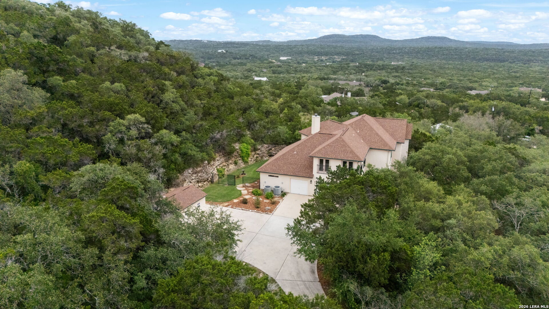 17431 Helotes Spring Road Helotes, TX 78023 - Photo 46 of 50 an aerial view of residential houses with outdoor space and trees