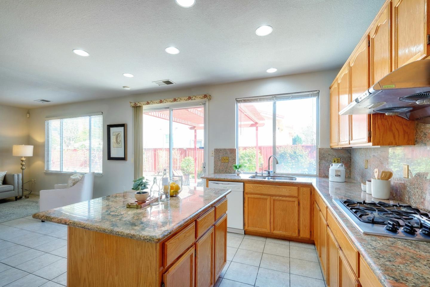 2194 Sierra Road San Jose, CA 95131 - Photo 14 of 45 a kitchen with kitchen island granite countertop a sink stove and cabinets