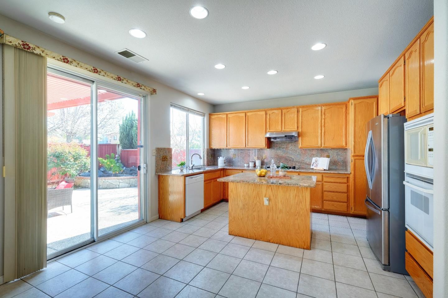 2194 Sierra Road San Jose, CA 95131 - Photo 15 of 45 a kitchen with stainless steel appliances granite countertop a refrigerator and a stove top oven