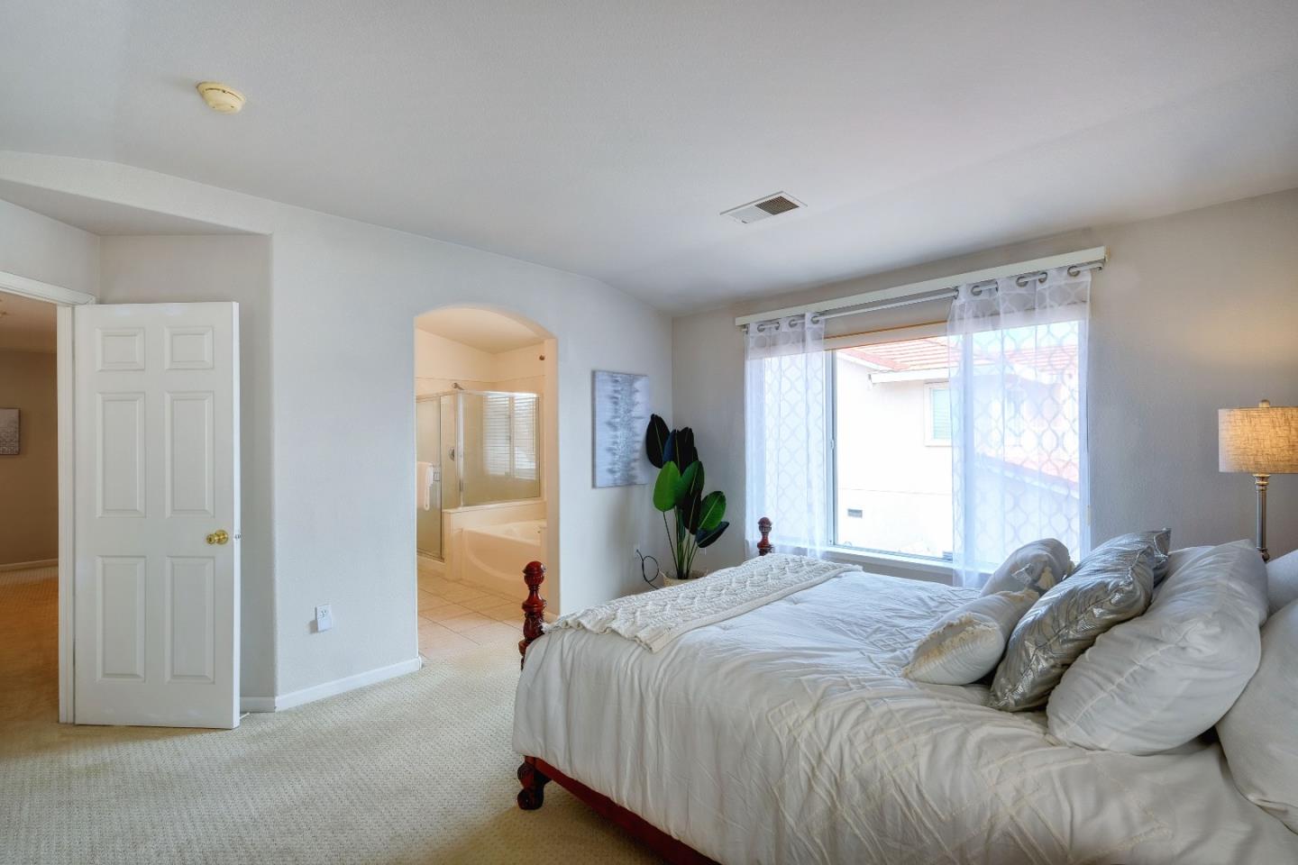 2194 Sierra Road San Jose, CA 95131 - Photo 22 of 45 a bedroom with a bed and a window