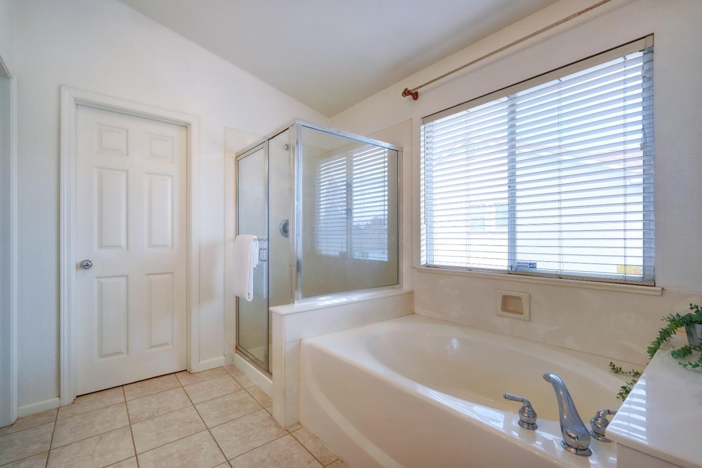 2194 Sierra Road San Jose, CA 95131 - Photo 26 of 45 a bathroom with a bathtub and shower
