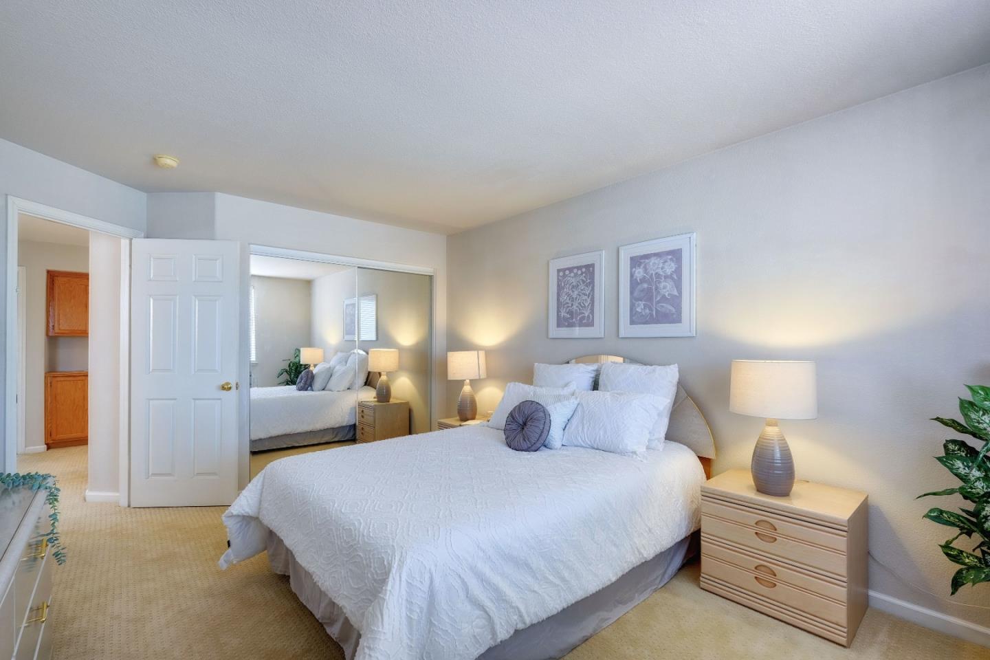 2194 Sierra Road San Jose, CA 95131 - Photo 27 of 45 a bedroom with a bed and a lamp