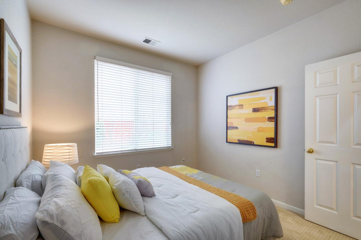 2194 Sierra Road San Jose, CA 95131 - Photo 32 of 45 a bedroom with a bed and a window