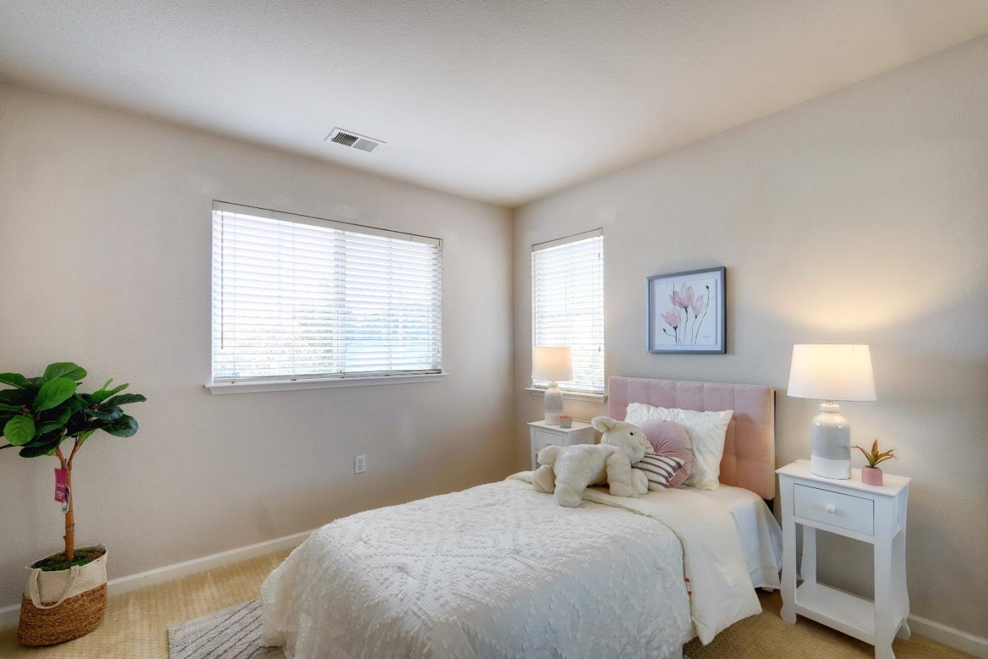 2194 Sierra Road San Jose, CA 95131 - Photo 33 of 45 a bedroom with bed and a potted plant