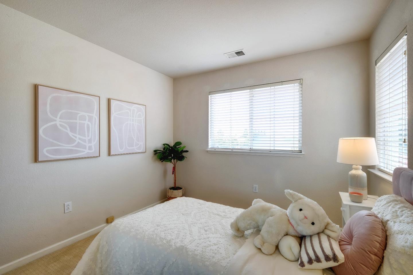 2194 Sierra Road San Jose, CA 95131 - Photo 34 of 45 a bedroom with a bed and a window