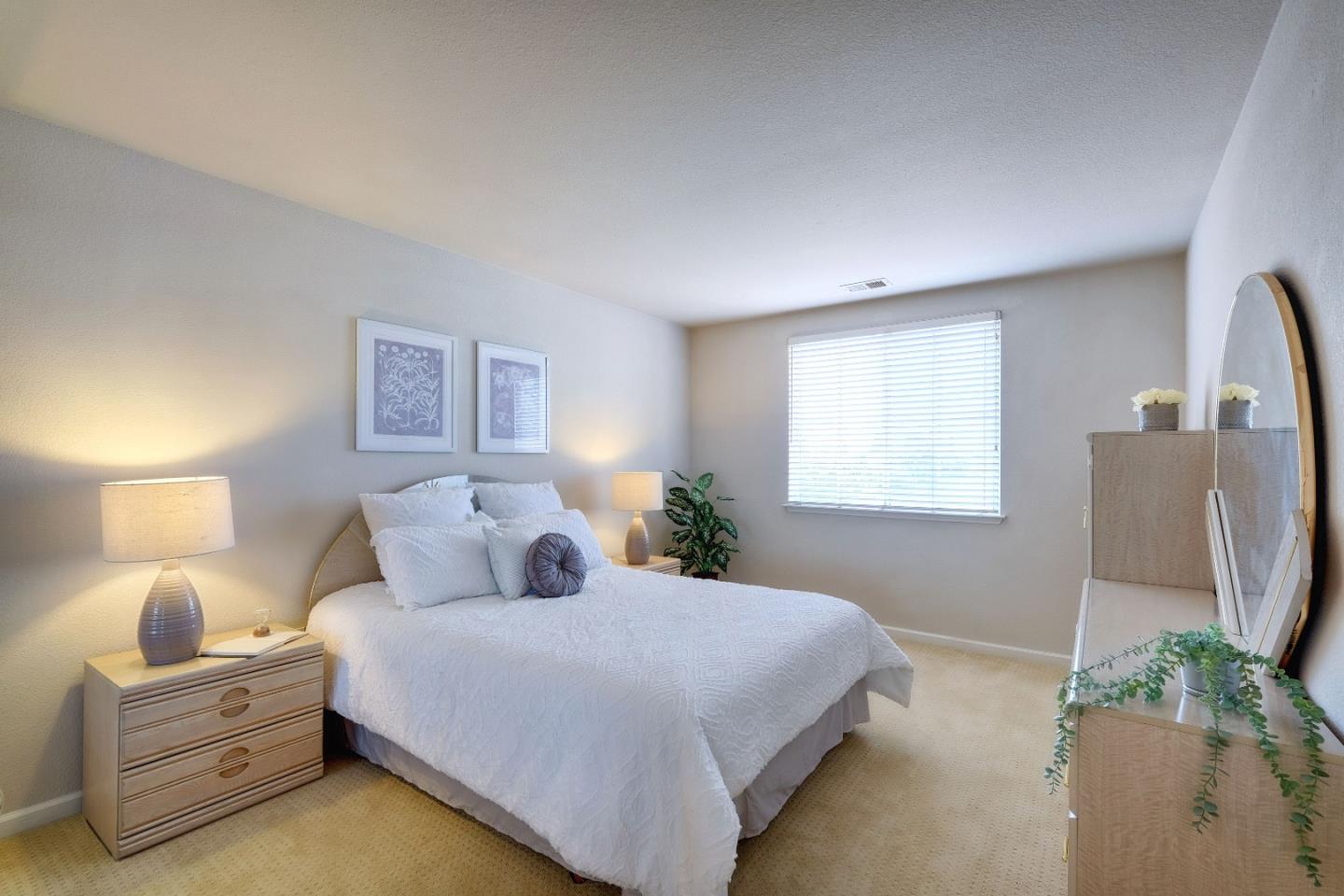 2194 Sierra Road San Jose, CA 95131 - Photo 36 of 45 a bedroom with a bed windows and a lamp