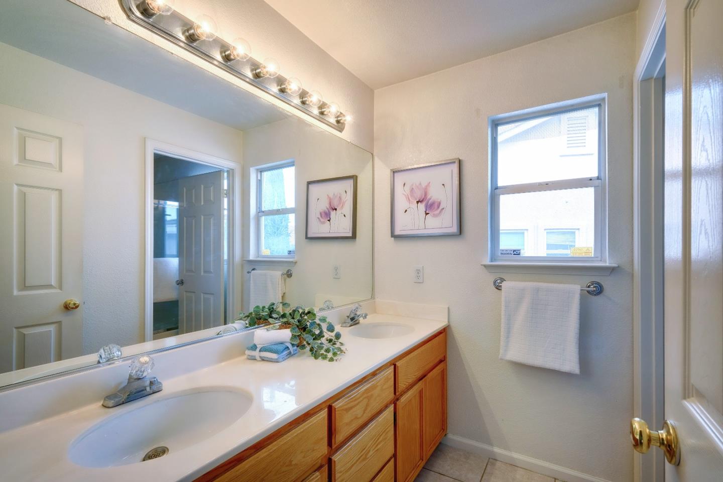 2194 Sierra Road San Jose, CA 95131 - Photo 39 of 45 a bathroom with a sink and a mirror