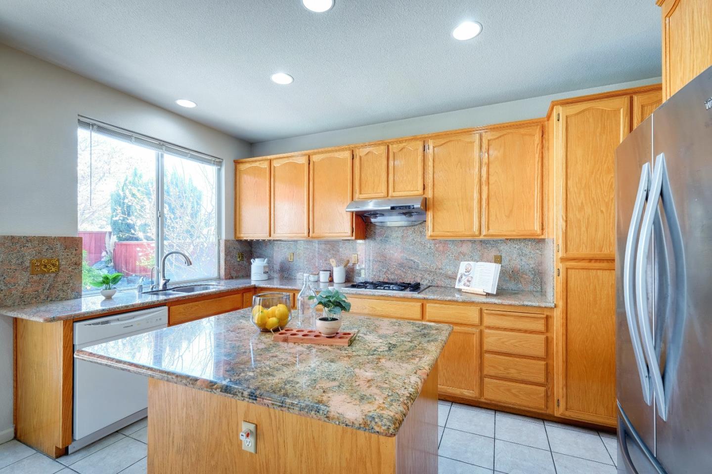 2194 Sierra Road San Jose, CA 95131 - Photo 7 of 45 a kitchen with stainless steel appliances granite countertop a sink a stove and a refrigerator