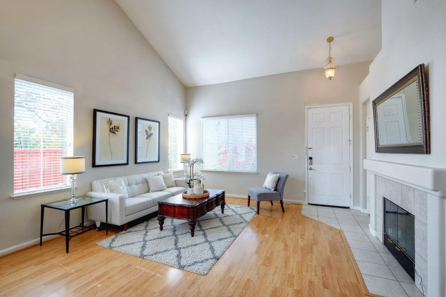 2194 Sierra Road San Jose, CA 95131 - Photo 8 of 45 a living room with furniture a window and a fireplace