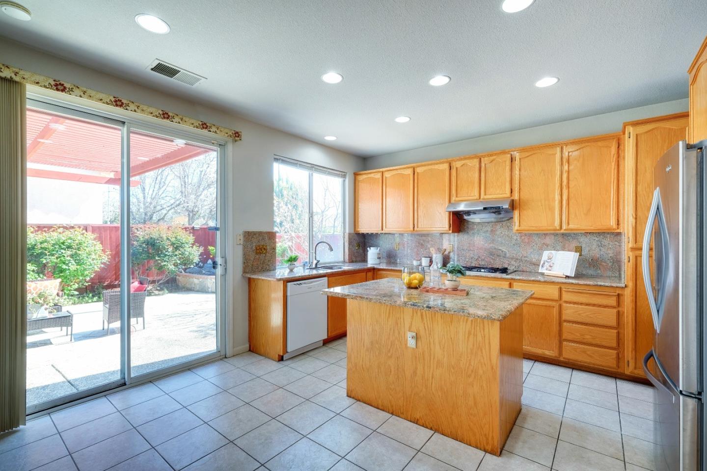 2194 Sierra Road San Jose, CA 95131 - Photo 10 of 45 a kitchen with stainless steel appliances granite countertop a stove a sink and a refrigerator