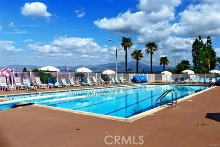 a view of swimming pool with outdoor seating