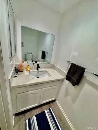 a bathroom with a sink and mirror