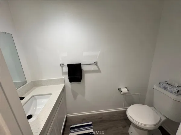 a bathroom with a toilet a sink and a shower