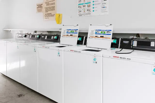 a view of a house with swimming pool and sitting area