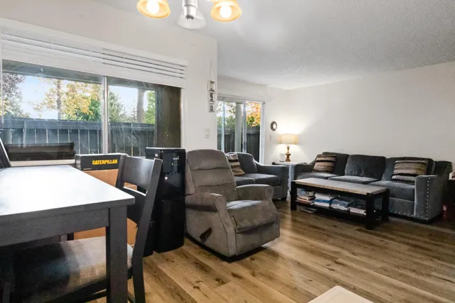 a living room with furniture and a table