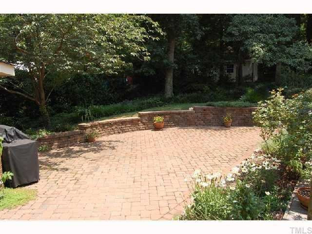 6413 Arrington Road Raleigh, NC 27607 - Photo 10 of 12 Huge patio is great for grilling and entertaining and has walls with built-in lighting. Patio/Deck