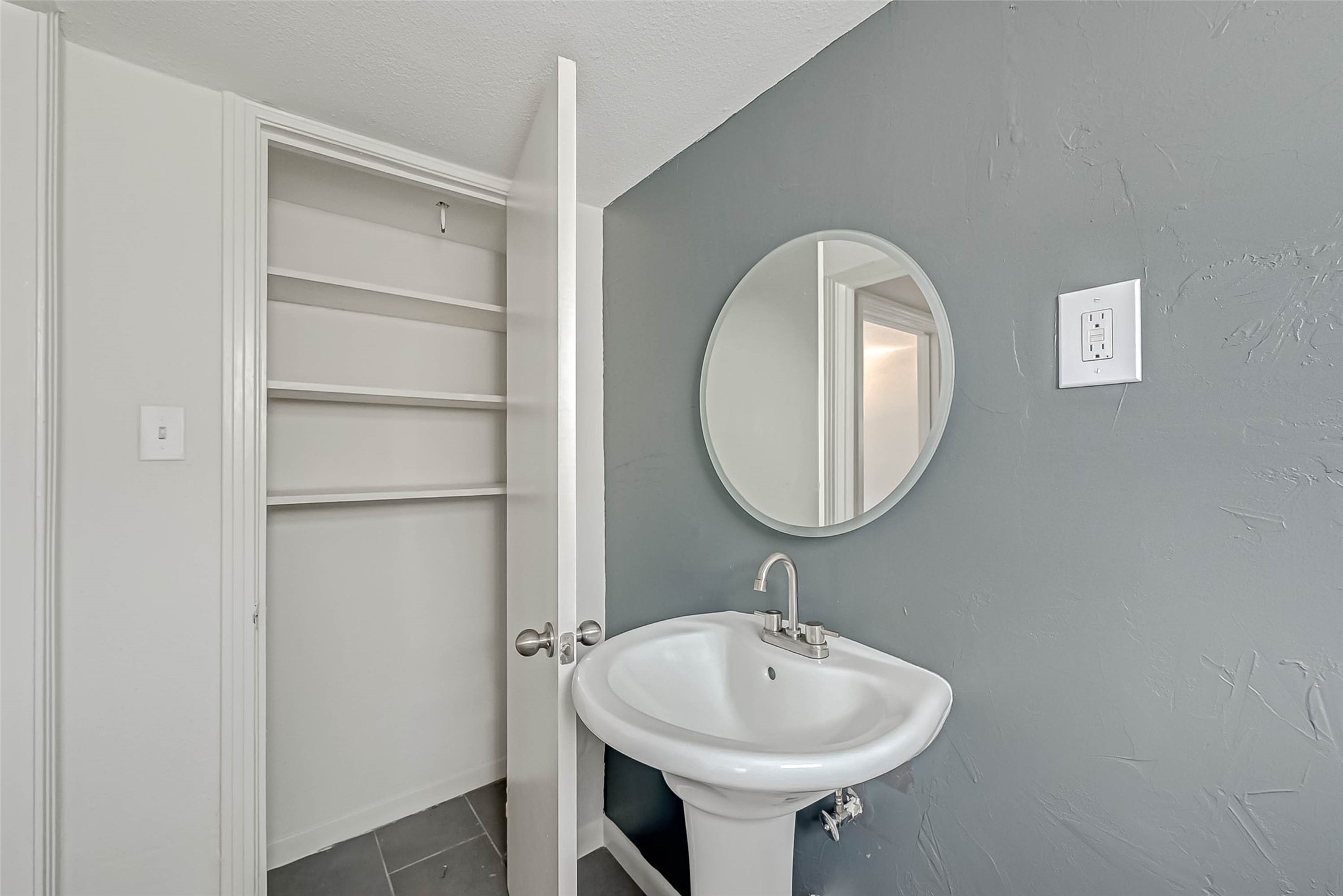 2420 McDuffie Street, Unit 1A Houston, TX 77019 - Photo 11 of 11 a bathroom with a sink and a mirror